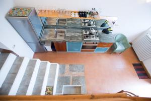 a view of a kitchen from the top of a room at La Cantina - ACrapa Mangia in Santa Maria di Castellabate