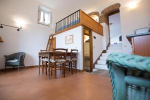 a dining room with a table and chairs at La Cantina - ACrapa Mangia in Santa Maria di Castellabate