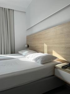 Posteľ alebo postele v izbe v ubytovaní Catherine Hotel