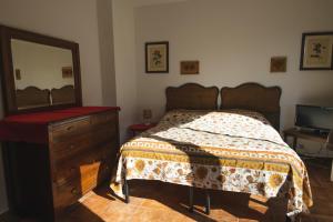 מיטה או מיטות בחדר ב-Larice
