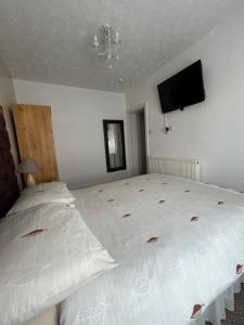 Postel nebo postele na pokoji v ubytování Bayona Guest House