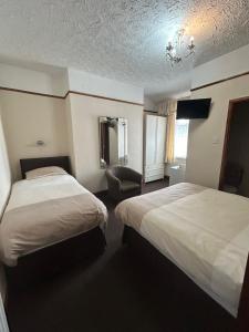 Postel nebo postele na pokoji v ubytování Bayona Guest House