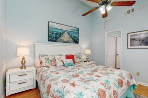 a bedroom with a bed and a ceiling fan at Forest Ridge 2888 in Fernandina Beach