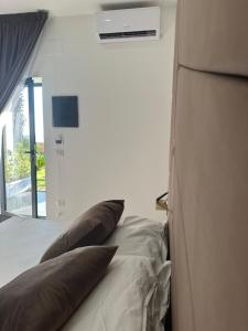 a bedroom with a bed with two pillows on it at Luxury Resort in Licola