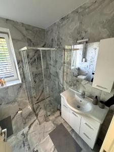 a bathroom with a shower and a sink at Villa Moste 3-Free parking&pool in Ljubljana