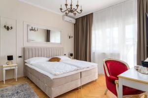 Postel nebo postele na pokoji v ubytování Storge Boutique Bed & Breakfast