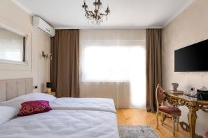 Postel nebo postele na pokoji v ubytování Storge Boutique Bed & Breakfast
