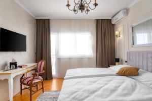 Postel nebo postele na pokoji v ubytování Storge Boutique Bed & Breakfast