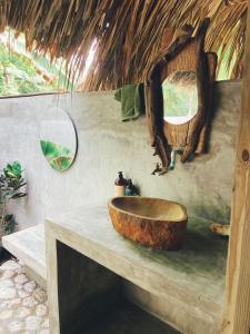 a bathroom with a wooden sink on a counter at Agua de Luna in Isla Fuerte