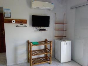 TV a/nebo společenská místnost v ubytování Pousada Acuípe