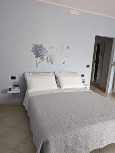 Postel nebo postele na pokoji v ubytování NULA Private Suites