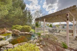 a backyard with a koi pond and a gazebo at New Kensington Vacation Rental with Shared Patio! in New Kensington