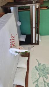 a room with a bunk bed with two pillows at Hotel Sonno Caliza Tulum in Tulum