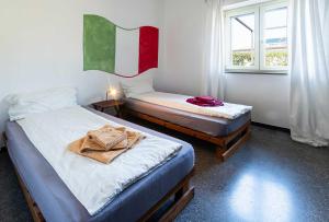 En eller flere senge i et værelse på Casa Carlo - ACrapa Mangia