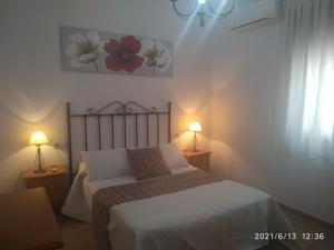 Cama o camas de una habitación en Apartmentos Corona