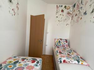 Postelja oz. postelje v sobi nastanitve Apartma ROGATEC