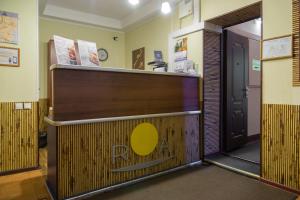 a lobby with a reception desk and a door at RA Hotel at Tambovskaya 11 in Saint Petersburg