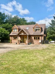 a brick house with a gambrel roof at Private Entry Double bedroom with beautiful views! in Solihull