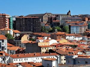 a group of buildings in a city with red roofs at Apartamento Céntrico-parking gratis Julio y Agosto-Wifi in Santander