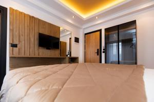 Postel nebo postele na pokoji v ubytování Hotel Joni
