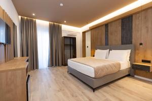 Postel nebo postele na pokoji v ubytování Hotel Joni
