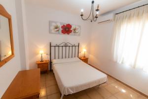 Cama o camas de una habitación en Apartmentos Corona