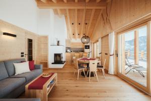 a living room with a couch and a table at Chalet Lärchenhof in Colfosco