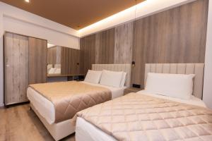 Postel nebo postele na pokoji v ubytování Hotel Joni