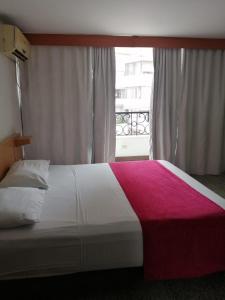Postel nebo postele na pokoji v ubytování HOTEL del OESTE B&B