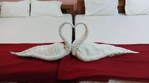 A bed or beds in a room at sudhara Residecy