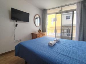 A bed or beds in a room at Holiday Canarias El Tablado