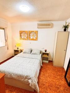 a bedroom with two beds in a room at CASA JARDIN DE MAR in Torrevieja