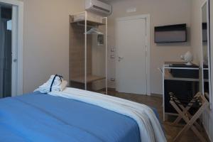 Postel nebo postele na pokoji v ubytování Gigli Rooms