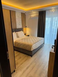 Postel nebo postele na pokoji v ubytování Hotel Joni