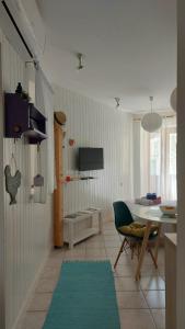 a living room with a table and a dining room at Apartment Zlatko in Šibenik