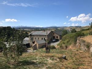 an old house on a hill with a road at Grande maison de vacances - Montagne Pyrénées in Planès