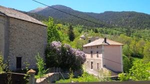 an image of a village with mountains in the background at Grande maison de vacances - Montagne Pyrénées in Planès +13 photos
