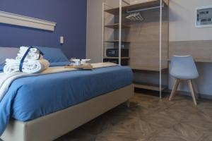 Postel nebo postele na pokoji v ubytování Gigli Rooms