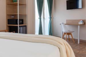 TV a/nebo společenská místnost v ubytování Gigli Rooms