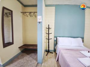 Tempat tidur dalam kamar di Pousada Ponta de Areia