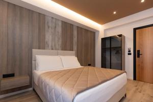 Postel nebo postele na pokoji v ubytování Hotel Joni