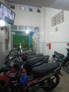 a row of motorcycles parked in a room at Hotel Phương Linh 360 phạm hùng in Ho Chi Minh City