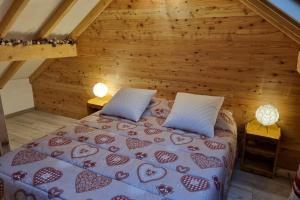 a bedroom with a bed in a attic at Estatico 1 - T2 duplex apartment sleeps 4 in Névache