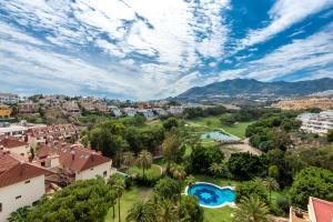 an aerial view of a city with a resort at golf y playa in Benalmádena