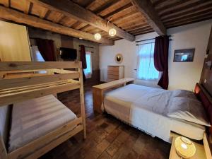 Postel nebo postele na pokoji v ubytování B&B Ca Rossa