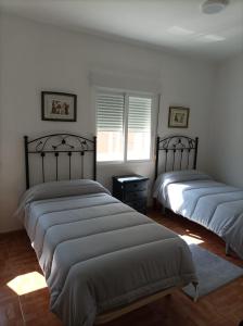 Posteľ alebo postele v izbe v ubytovaní Apartamento O Vento