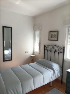 Posteľ alebo postele v izbe v ubytovaní Apartamento O Vento