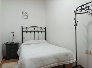 Posteľ alebo postele v izbe v ubytovaní Apartamento O Vento