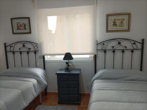 Posteľ alebo postele v izbe v ubytovaní Apartamento O Vento