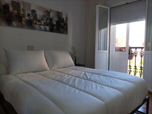 Posteľ alebo postele v izbe v ubytovaní Apartamento O Vento